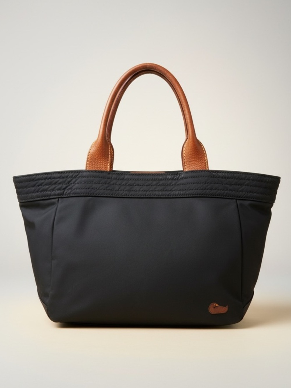 Dooney & Bourke Vintage Black Nylon Tote/Satchel with Leather Handles.